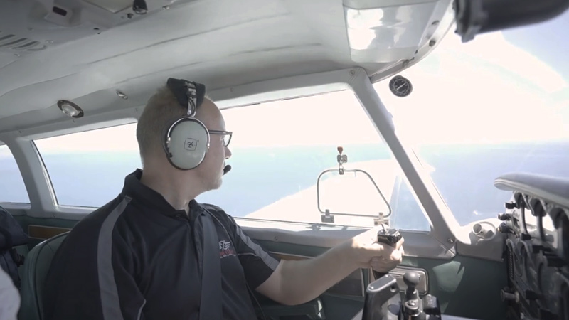 Dr Paul Dare in plane